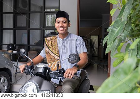 Muslim Male Going To The Mosque By Riding Motorbike