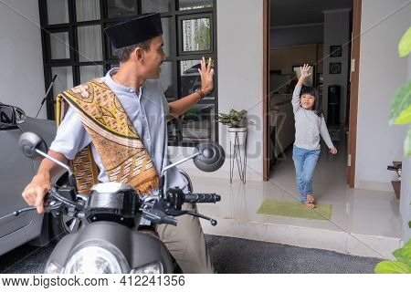 Father Waving Goodbye To His Daugther At Front House Before Leaving To The Mosque