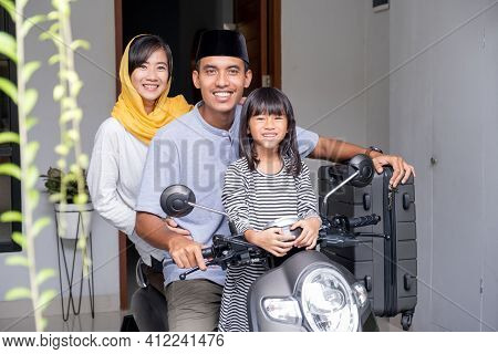 Asian Muslim Family Riding Motorbike Scooter Together Traveling With Kid