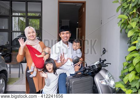 Asian Muslim Family Riding Motorbike Scooter Together Traveling With Kid
