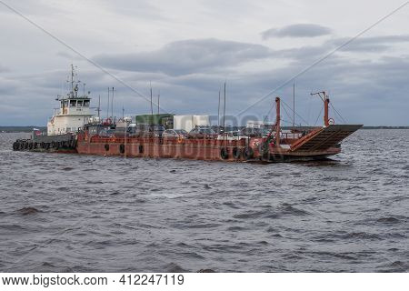 Salehard, Russia - August 29, 2018: Ferry With Cars On The Ob River On A Cloudy August Day