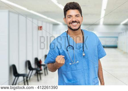 Laughing Hispanic Male Doctor Is Ready For Vacinating Patients Against Coronavirus Infection