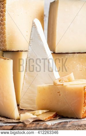 Cheese Board Of Various Types Of Soft And Hard Cheese. Spanish Manchego Cheese, International Dairy 