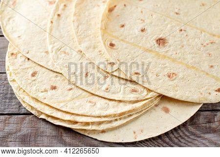 Grilled Tortillas, Flat Breads On A Wooden Table