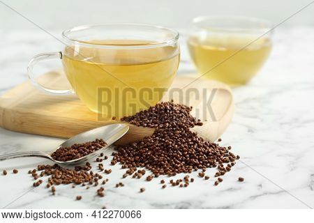Buckwheat Tea And Granules On White Marble Table