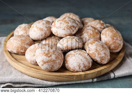 Plate With Tasty Homemade Gingerbread Cookies On Blue Table, Closeup
