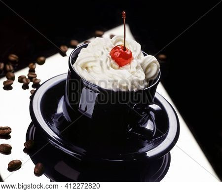 Still Life With Cup Of Coffee With Whipped Cream And Cherry