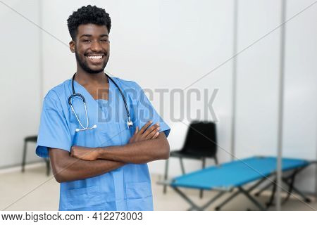 Handsome African Male Nurse At Vaccination Station Is Ready For Vacinating Patients Against Coronavi