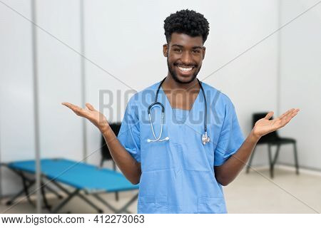 Friendly African Male Nurse At Vaccination Station Is Ready For Vacinating Patients Against Coronavi