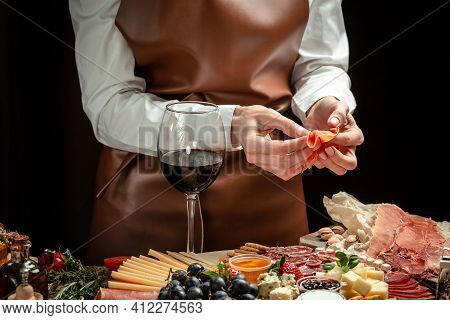 Antipasto Board With Sliced Meat, Ham, Salami, Cheese, Olives And Red Wine. Dinner Or Aperitivo Part