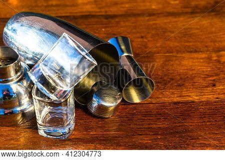 Bar Ustensils, Drink Concept. Cocktail Shaker Accessories On A Wooden Board.