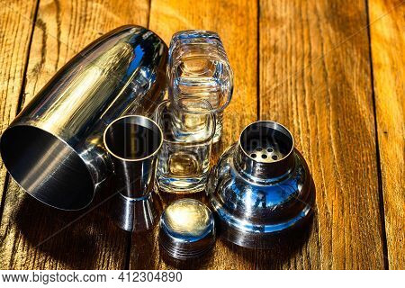 Bar Ustensils, Drink Concept. Cocktail Shaker Accessories On A Wooden Board.