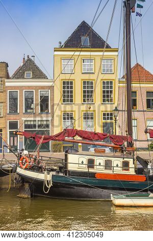 Old Ship In Front Of Historic Houses At The Canal In Zwolle, Netherlands