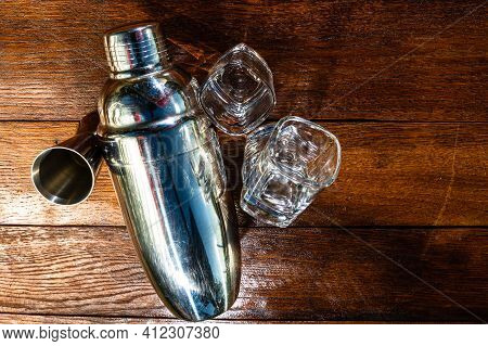 Bar Ustensils, Drink Concept. Cocktail Shaker Accessories On A Wooden Board.