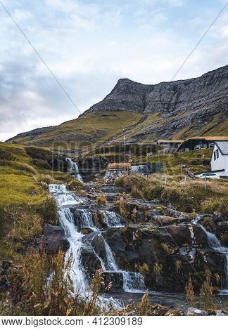 Bour Village Grass-covered Picturesque Houses At The Faroese Coastline In The Village Bour With View