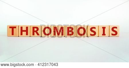 Medical And And Thrombosis Symbol. Wooden Cubes With The Word 'thrombosis'. Beautiful White Backgrou