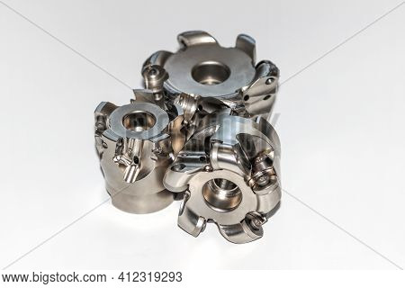 Two Undamaged And One Damaged Indexable Milling Cutter For Cnc Milling Machine With Selective Focus 