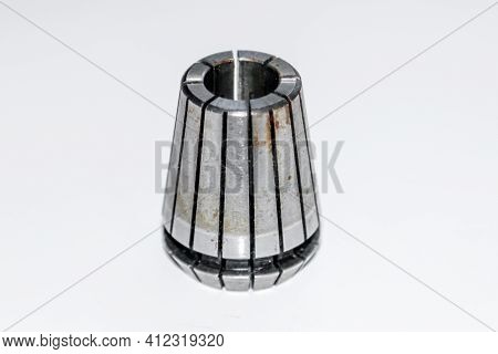A Chuck Spring Collet For Milling Machine With The Rust Stains With Selective Focus Isolated On Whit