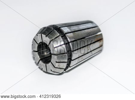 A Chuck Spring Collet For Milling Machine With The Rust Stains With Selective Focus Isolated On Whit