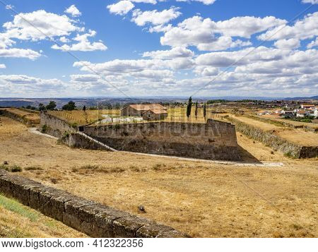 Almeida, Guarda, Portugal; August 2020: Entance And Fragment Of The Fortified Medieval Walls Of The 