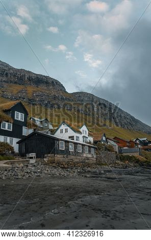 Bour Village Grass-covered Picturesque Houses At The Faroese Coastline In The Village Bour With View