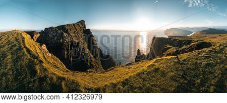 Aerial Drone Panorama View On Faroe Islands Suduroy Todwards Beinisvord During Sunset.