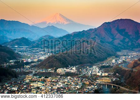 Otsuki, Japan Skyline with Mt. Fuji at twilight.