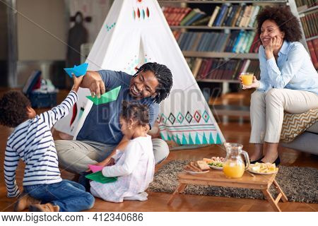 Happy family spending time in a cheerful atmopshere at home together. Family, together, love, playtime