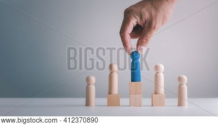 Businessman Hand Or Employer Chooses Takes In Hand Employee. Leader Stands Out From Crowd. Looking F