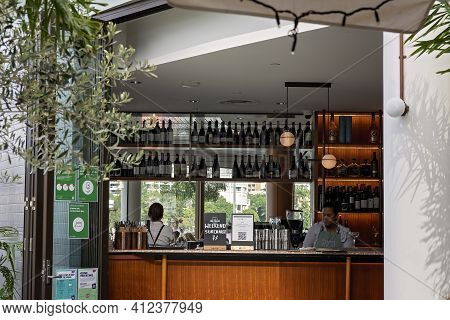Brisbane, Queensland, Australia - March 2021: Female Staff Tending Bar In A City Restaurant