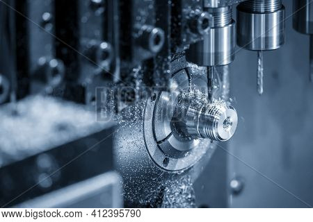 The  Operation Of Multi-tasking Cnc Lathe Machine Swiss Type Tapping On The Pipe Connector Parts. Th