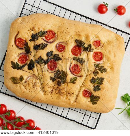 Food Art. Whole Focaccia, Pizza, Cut Flat Bread With Vegetables On Grid, Tradition Italian Cuisine. 