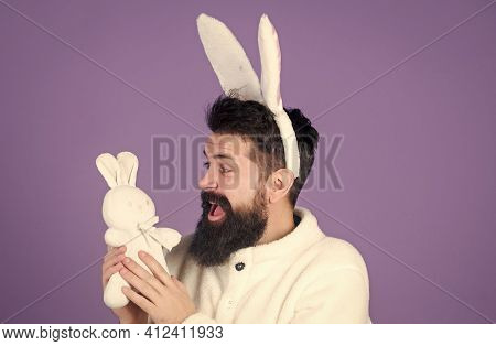 Soft And Tender. Guy With Bunny Or Rabbit Ears On Violet Background. Enjoy Tenderness. Childhood Mem