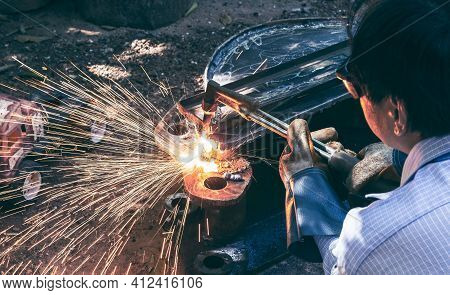 Close Up Hand Heavy Industrial Worker Is Working On Metal Work Factory Process By Cutting Sheet Stee
