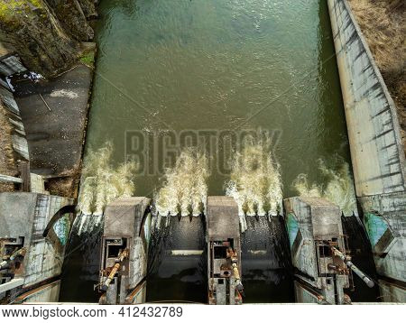 Aerial Drone View, Small Dam Over Olt River At Springtime In Transylvania, Romania.