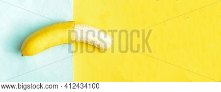 One Partially Peeled Banana On Blue Yellow Background, Cpyspace.tropic Summer Fruit