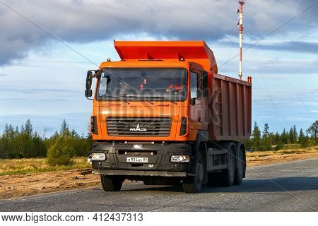 Novyy Urengoy, Russia - June 3, 2020: Orange Dump Truck Maz 6501 Kolos In The City Street.