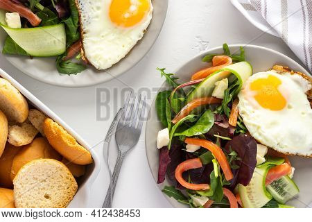 Fresh Organic Mesclun Mix Salad With Cucumber, Mozzarella And Salmon, Scrambled Eggs And Dry Buns , 