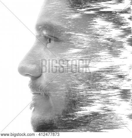 A creative profile portrait of a man in black and white with texture effect