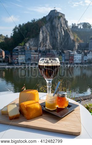 Glass Of Belgian Abbey Beer And Tasting Of Cheeses Made With Trappist Beer And Fine Herbs With View