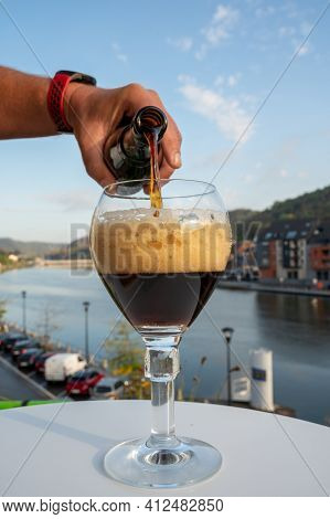 Pouring Of Belgian Abbey Beer And Tasting Of Cheeses Made With Trappist Beer And Fine Herbs With Vie