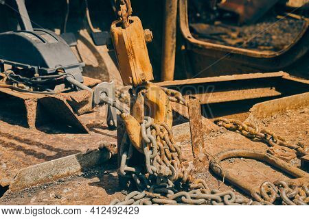 Side View Reel And Chain And U Bolt And Automatic Gear Handle On Rusty Old Car Interior In Vintage T