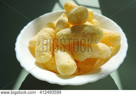 Crunchy Corn Snacks , Corn Sticks With Powdered Sugar, Contrast Of Sunlight And Shadow