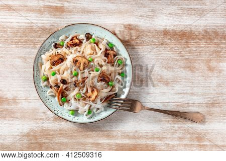Vegan Konjac Pasta With Mushrooms And Green Peas, Shot From The Top