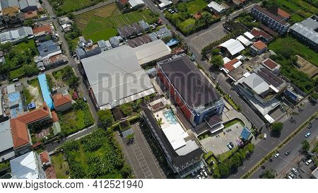 Kuta, Bali, Indonesia, March 13, 2021. Aerial Drone View Of Kuta City. Flying Over Bali Villas In Ku