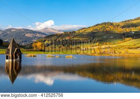 autumn pond under the mountains, Murau district,
Styria, Austria