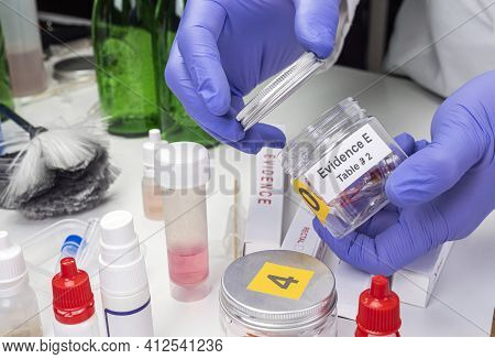 Blood-stained Glass Sample In An Evidence Jar, Concept Image