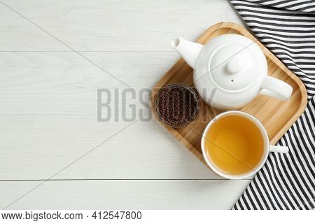 Buckwheat Tea And Granules On White Wooden Table, Flat Lay. Space For Text