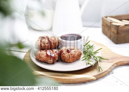 Fried Chicken Kievs, Poultry Cutlets On A White Plate, On A Wood Cutting Board. De Volaille, Meat Pa