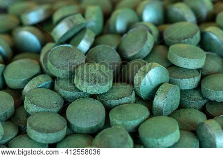 Stack Of Spirulina Green Pills (dietary Supplement)